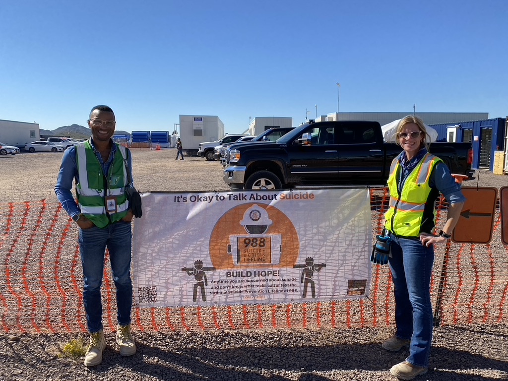 CSPP member, Natalie Cordova, unveiling a CSPP banner at one of her sites in Arizona